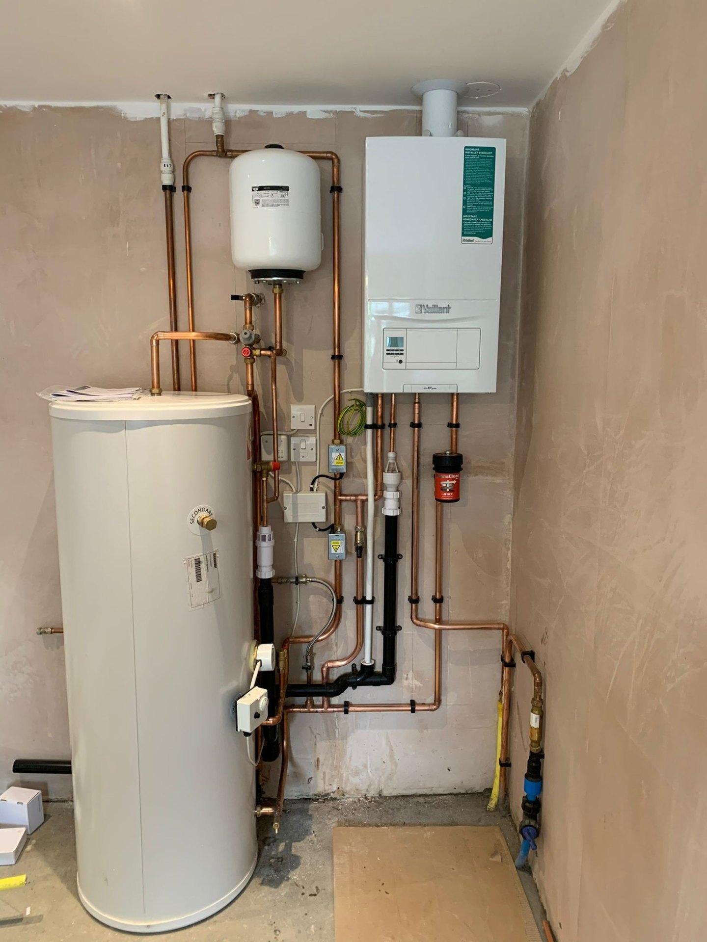 Full central heating installation with unvented cylinder, magnetic filter and copper pipework in Surrey