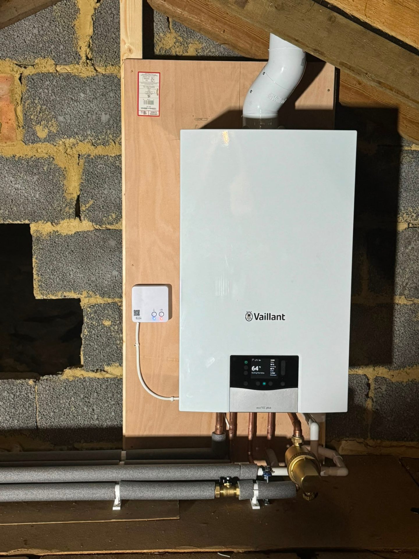Vaillant boiler swap on a chimney breast with tidy pipe drops, Surrey
