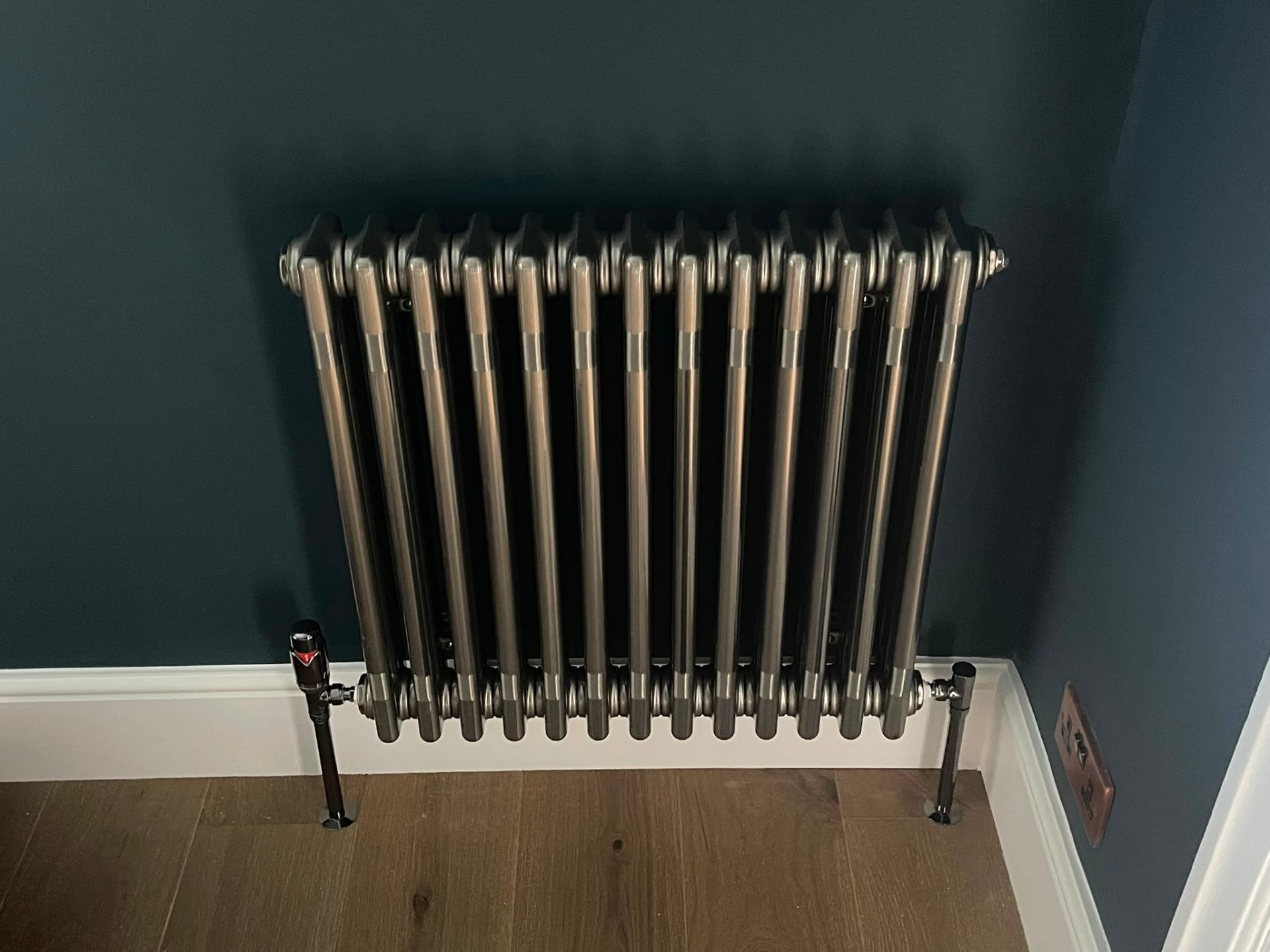 Traditional column radiator installation on a feature wall by Heat Solution London